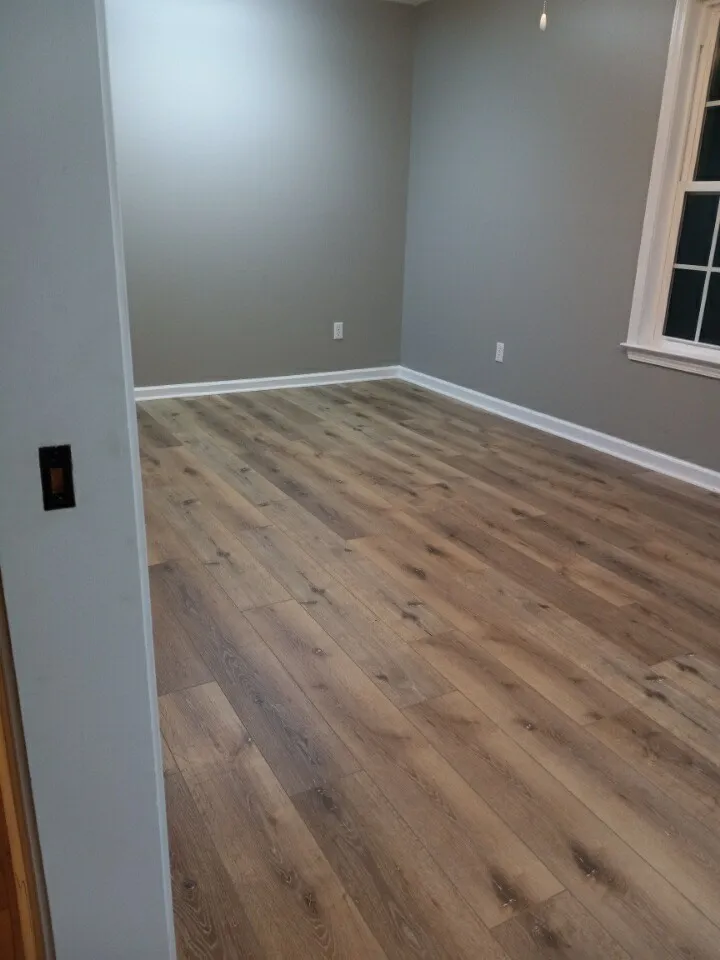 Luxury vinyl plank flooring in a bedroom in Parkwest, Guyton GA