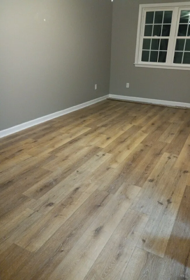 Luxury vinyl plank flooring in a living room in Parkwest, Guyton GA