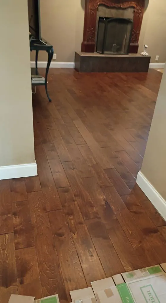 Engineered hardwood flooring installed in a living room with fireplace in Savannah Quarters, Pooler GA