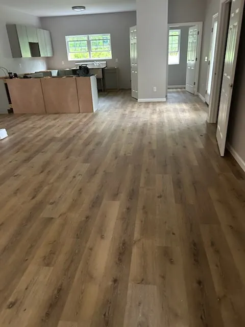 Luxury vinyl plank flooring installed in an open kitchen and living area in Godley Station, Pooler GA