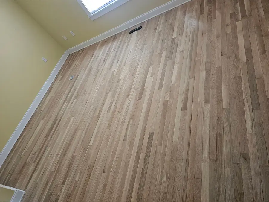 Bedroom hardwood floor sanded to bare wood