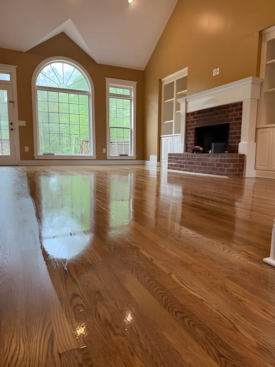 Refinished hardwood floor with a glossy stained finish