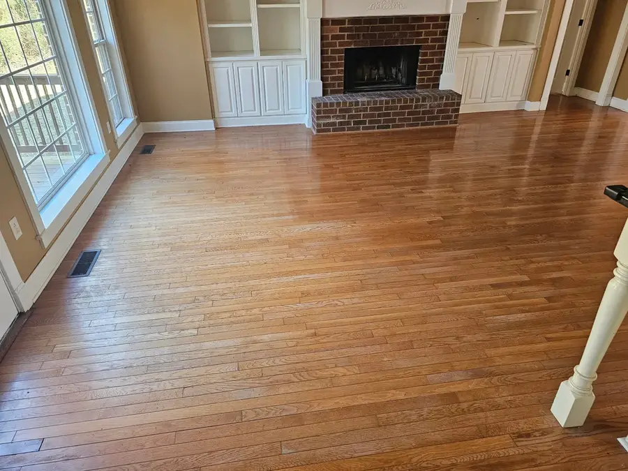 Hardwood floor before refinishing, worn and faded finish
