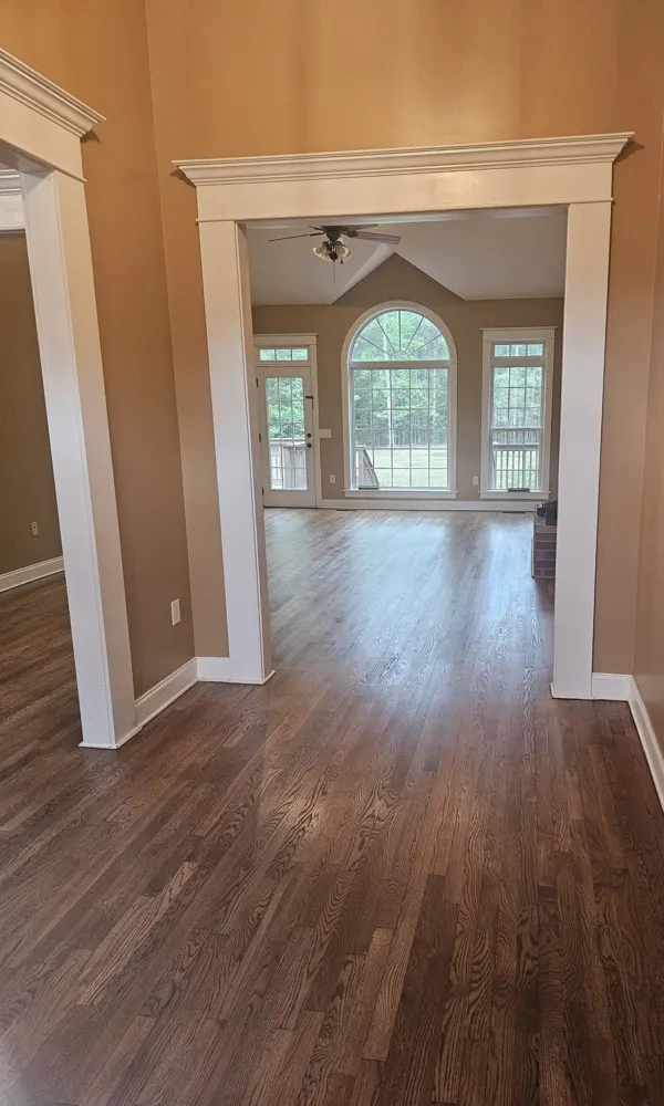 Engineered wood flooring through the entry and great room of a Strathy Hall home in Richmond Hill GA