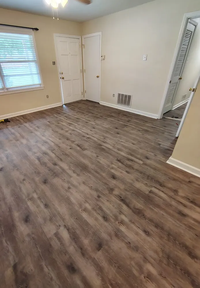 Gray luxury vinyl plank flooring in a living room in Buckhead, Richmond Hill GA