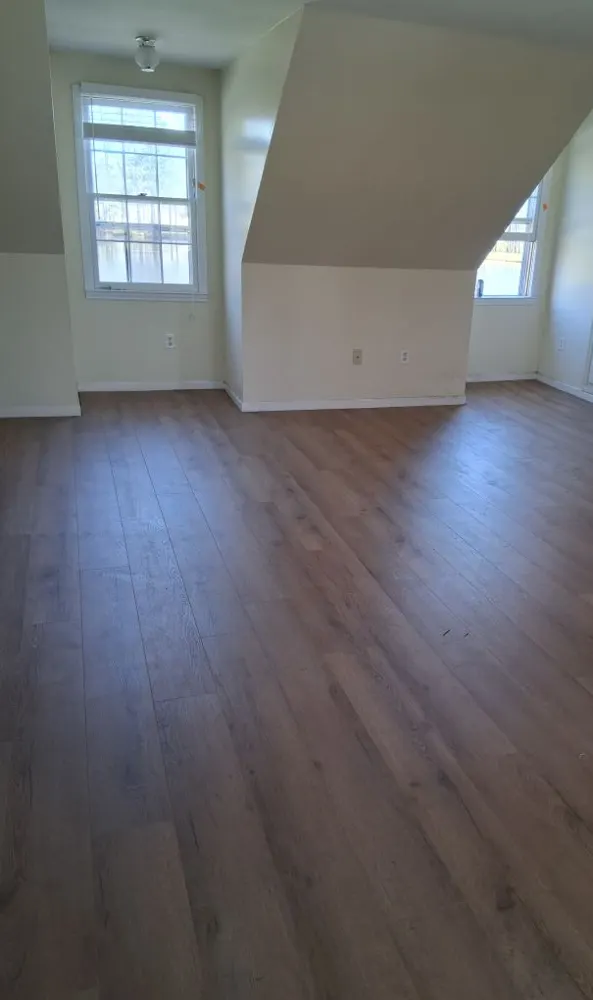 Luxury vinyl plank flooring in an upstairs room with dormer windows in Dunham Marsh, Richmond Hill GA