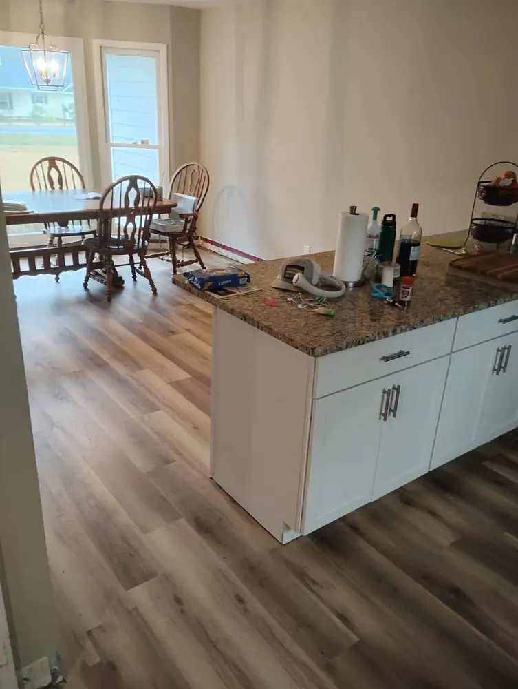 Luxury vinyl plank flooring in a kitchen and dining area in Westwood Heights, Rincon GA