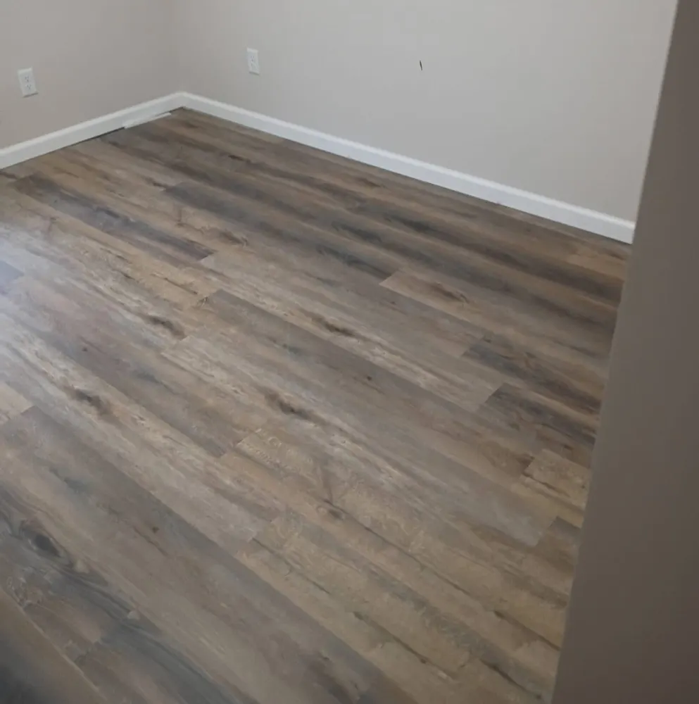 Commercial-grade glue-down luxury vinyl plank in a room at the Suncare Hospice building in Springfield GA