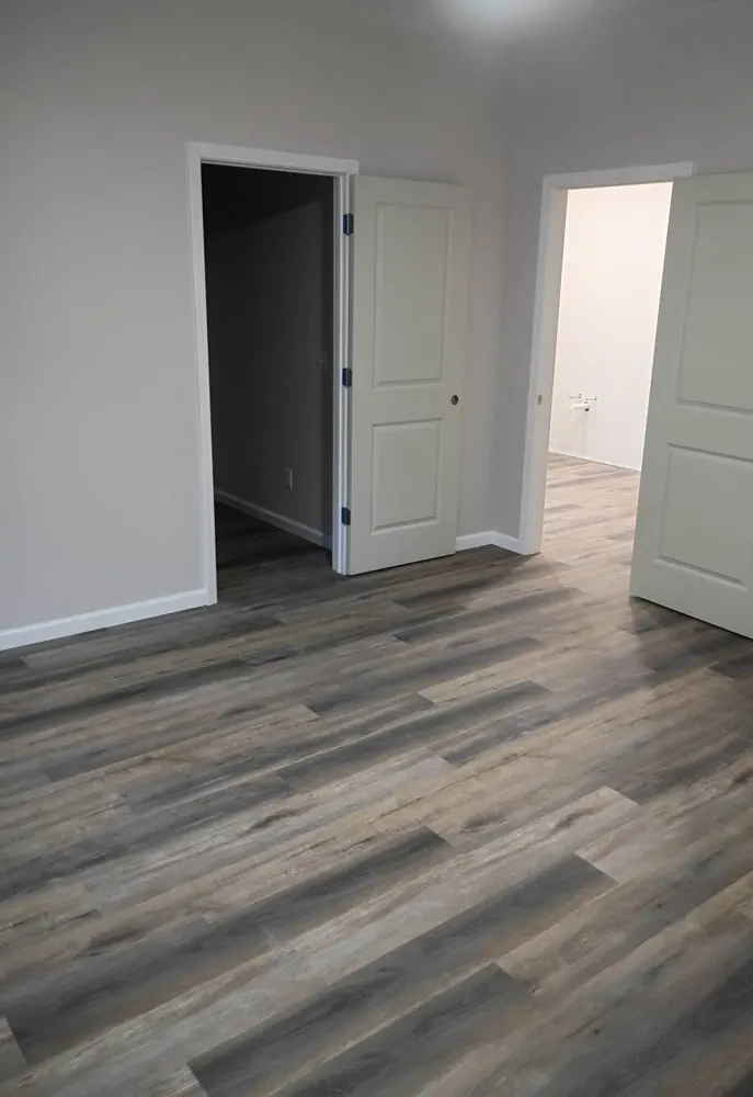 Commercial-grade glue-down LVP flooring in an office at the Suncare Hospice building in Springfield GA