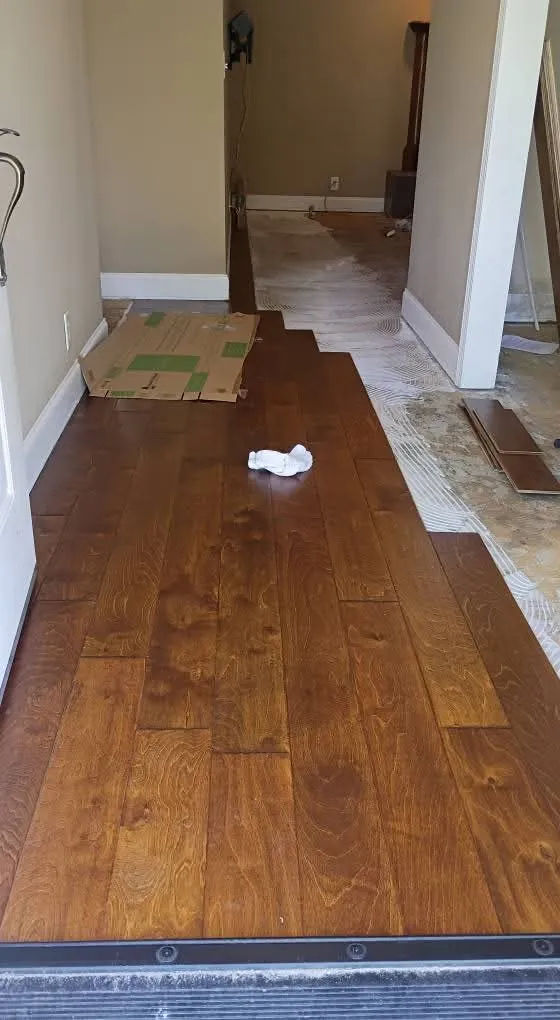 Glue-down engineered wood flooring in a front entry in the Downtown District, Springfield GA