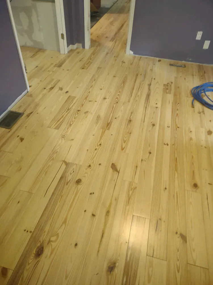 Solid pine hardwood flooring through a hallway and bedroom in Seines Landing, Springfield GA