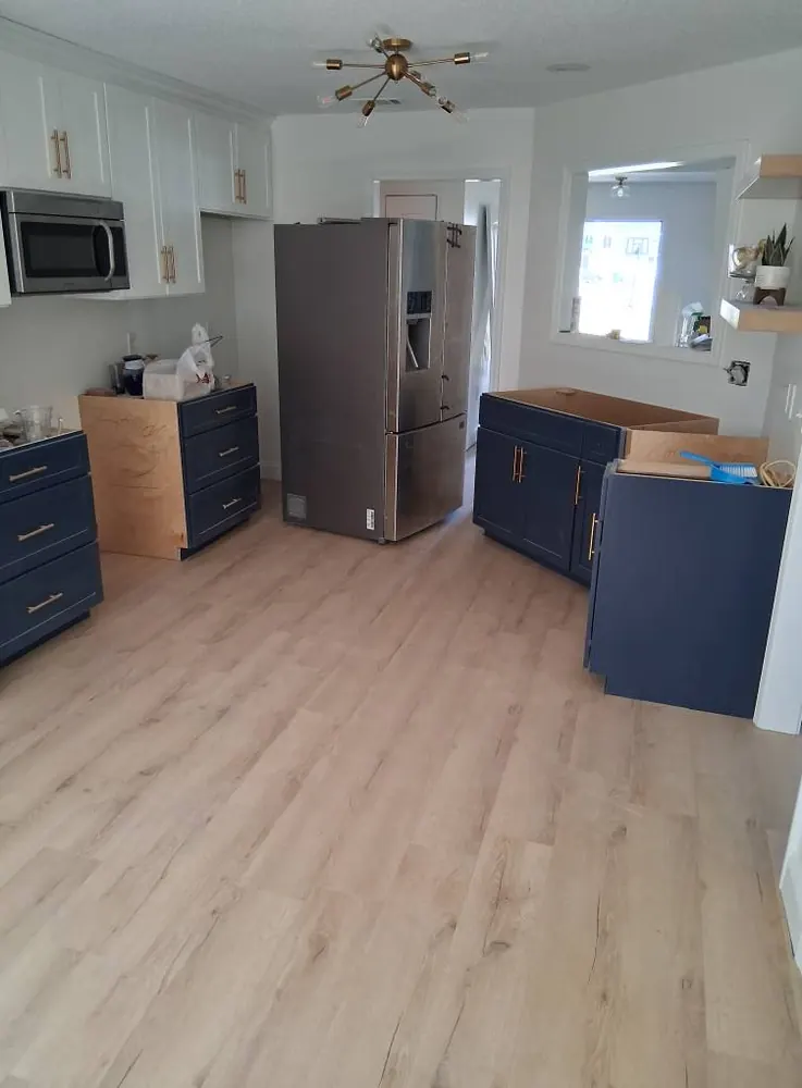 Luxury vinyl plank flooring in a remodeled kitchen in Beaubrook, Springfield GA